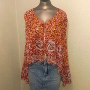 Free people orange & red print flare top.